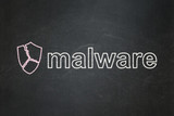 Safety concept: Broken Shield and Malware on chalkboard