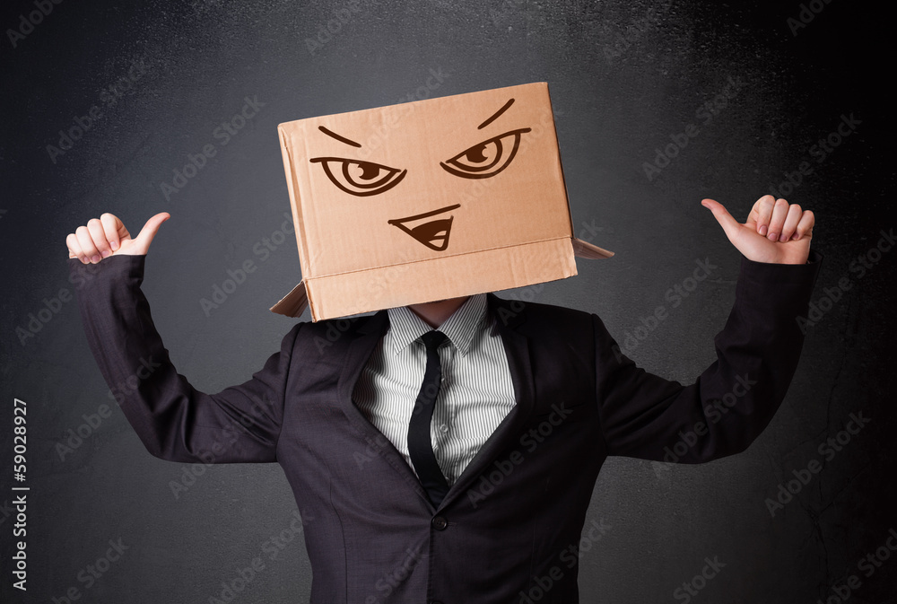 Businessman gesturing with a cardboard box on his head with evil Businessman gesturing with a cardboard box on his head with evil