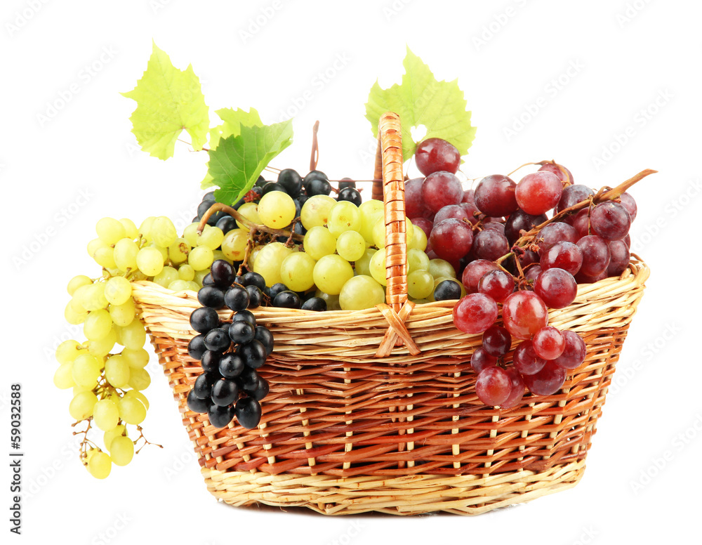 assortment of ripe sweet grapes in basket, isolated on white. assortment of ripe sweet grapes in basket, isolated on white.