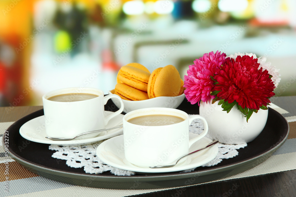 Cups of coffee on tray on table in cafe Cups of coffee on tray on table in cafe