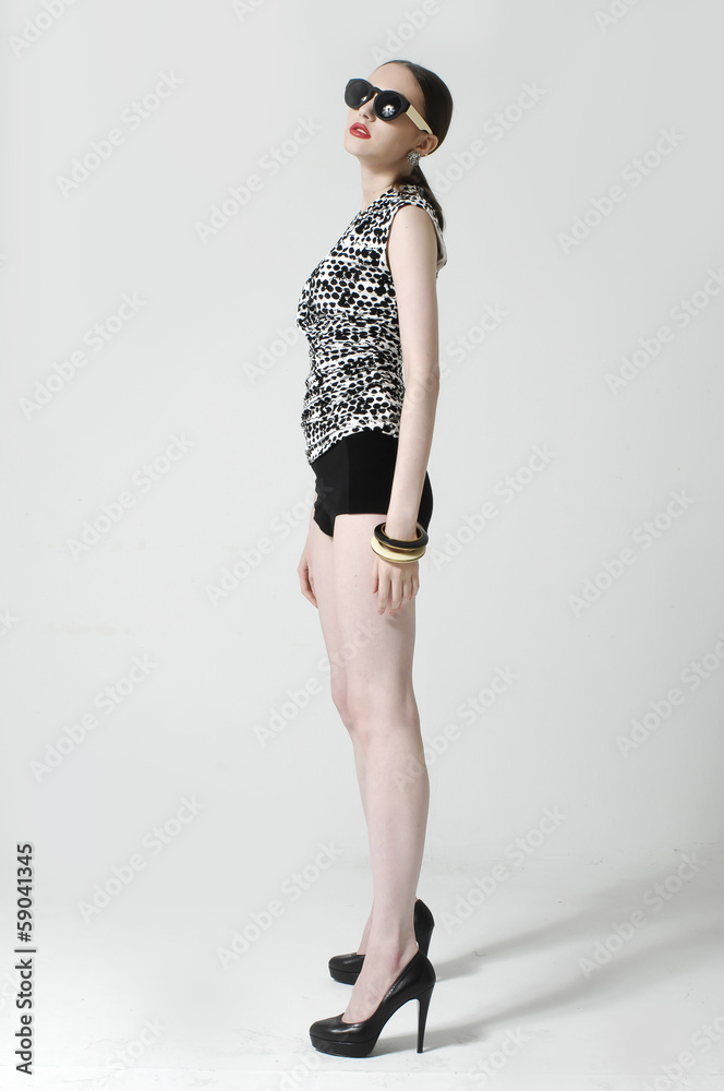 full-length beautiful young sexy woman wearing sunglasses full-length beautiful young sexy woman wearing sunglasses