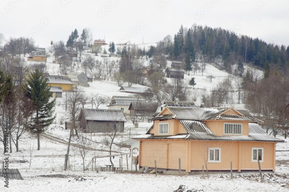 Ukrainian village in Carpathian mountains in wintertime.