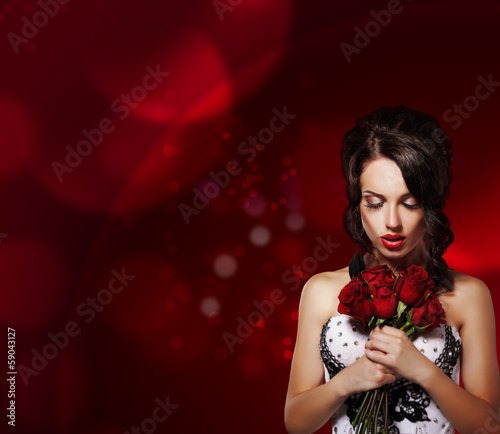 Dreamy Woman with Bouquet of Flowers over Purple Background
