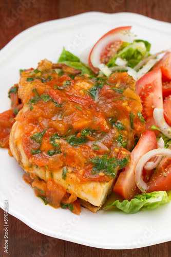 chicken with tomato sauce and salad