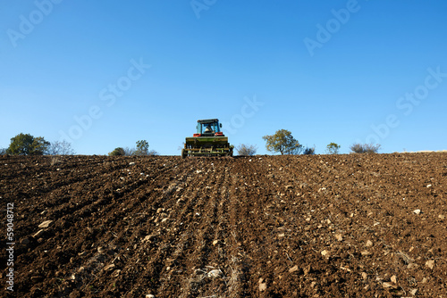agricultural tractor sowing seeds