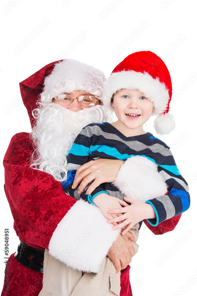 Classic Santa Claus hugging little boy. Classic Santa Claus hugging little boy.