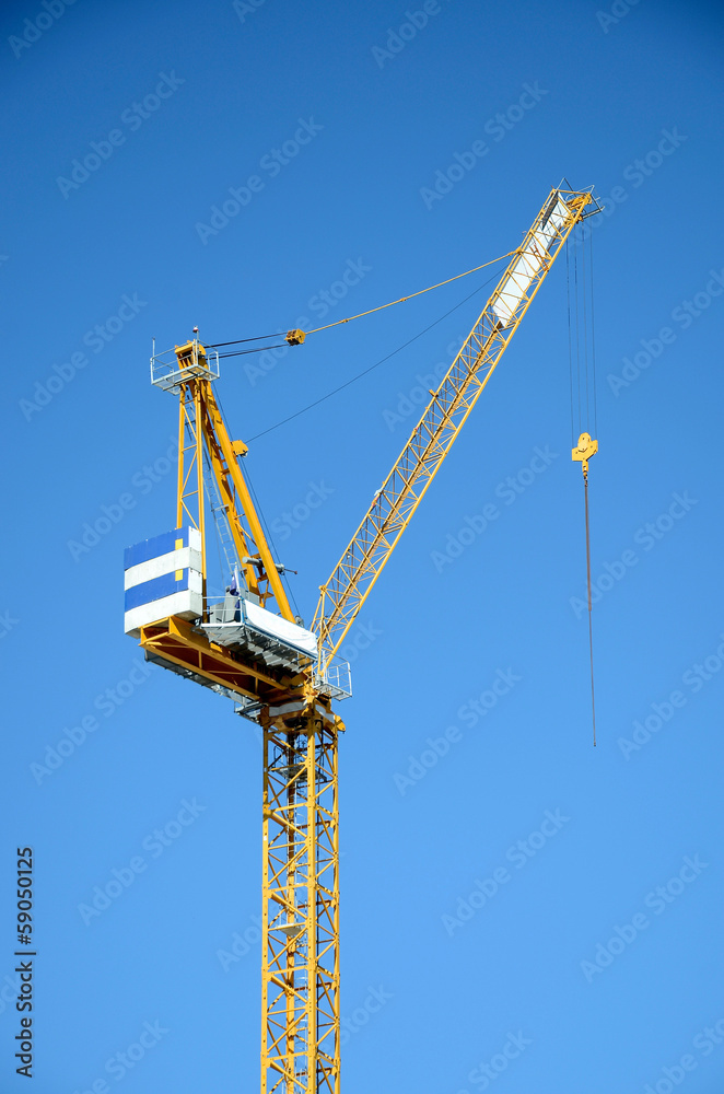 Large construction crane on blue sky Large construction crane on blue sky