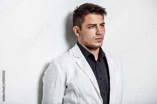 young man wearing white suit