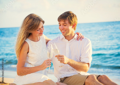 Honeymoon concept, Man and Woman in love, Couple enjoying glass