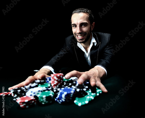 Fotografie poker player betting everything on one hand