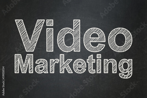 Finance concept: Video Marketing on chalkboard background