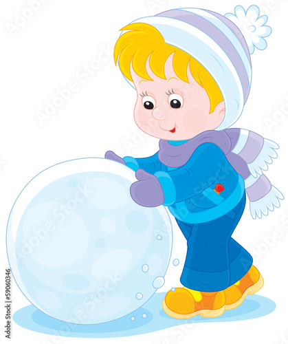 Child with a big snowball for a snowman