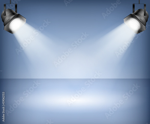 Blue background with spotlights. Studio.