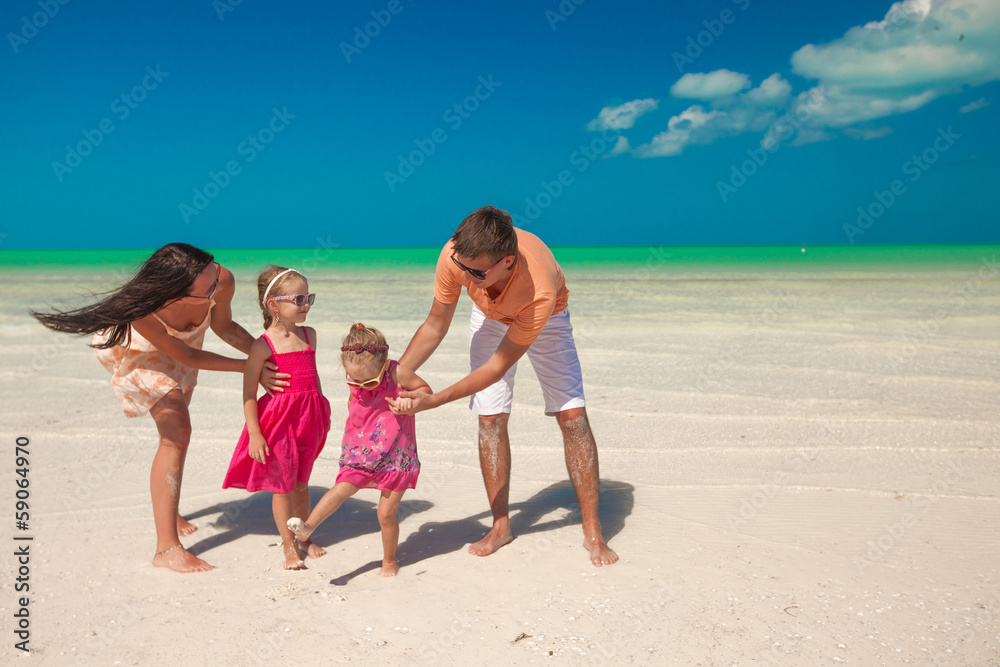 Family of four on beach vacation