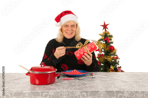 Woman of mature age alone with Christmas photo