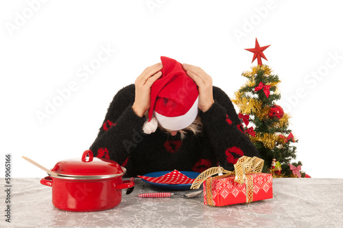 Woman of mature age alone with Christmas photo