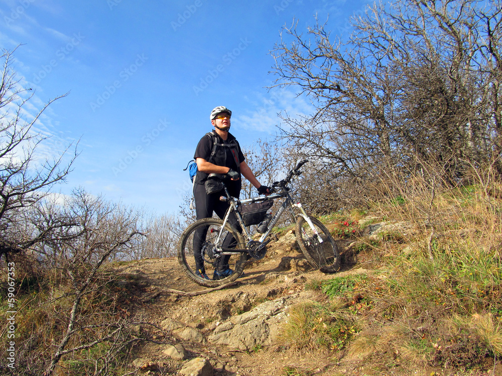 Cyclist on the top of a hill