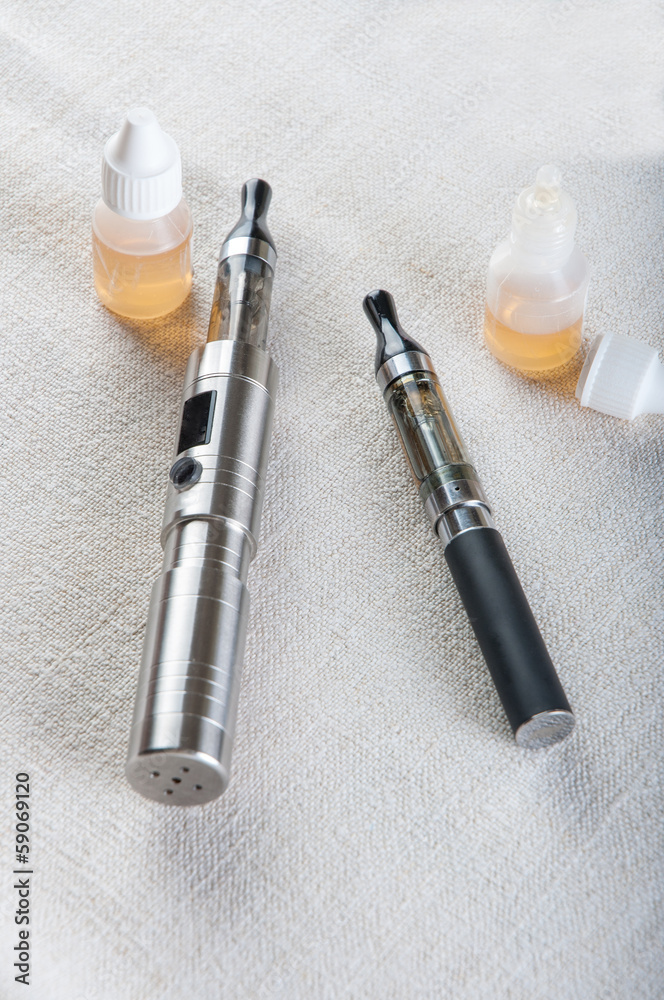 electronic cigarette on white fabric electronic cigarette on white fabric