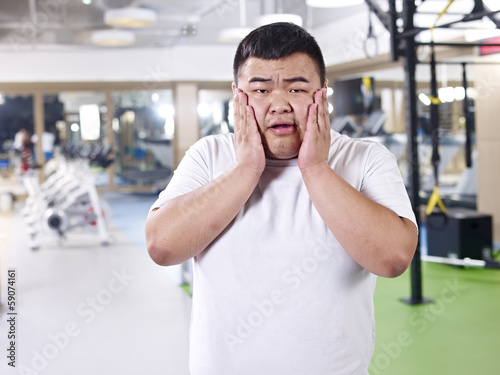 overweight man  in gym
