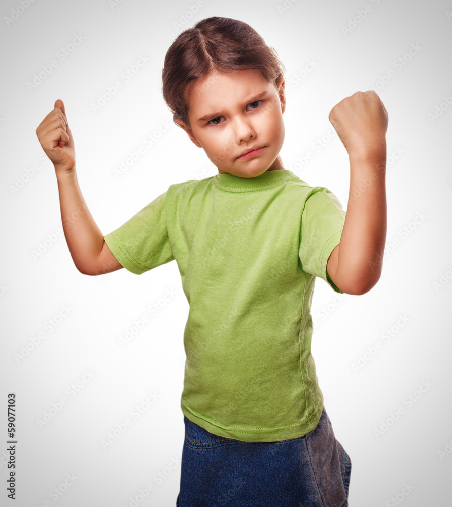 Angry evil girl female child shows fists experiencing anger and Angry evil girl female child shows fists experiencing anger and