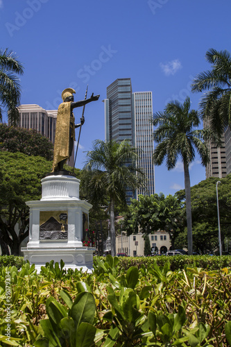 historical statue and modern buildings