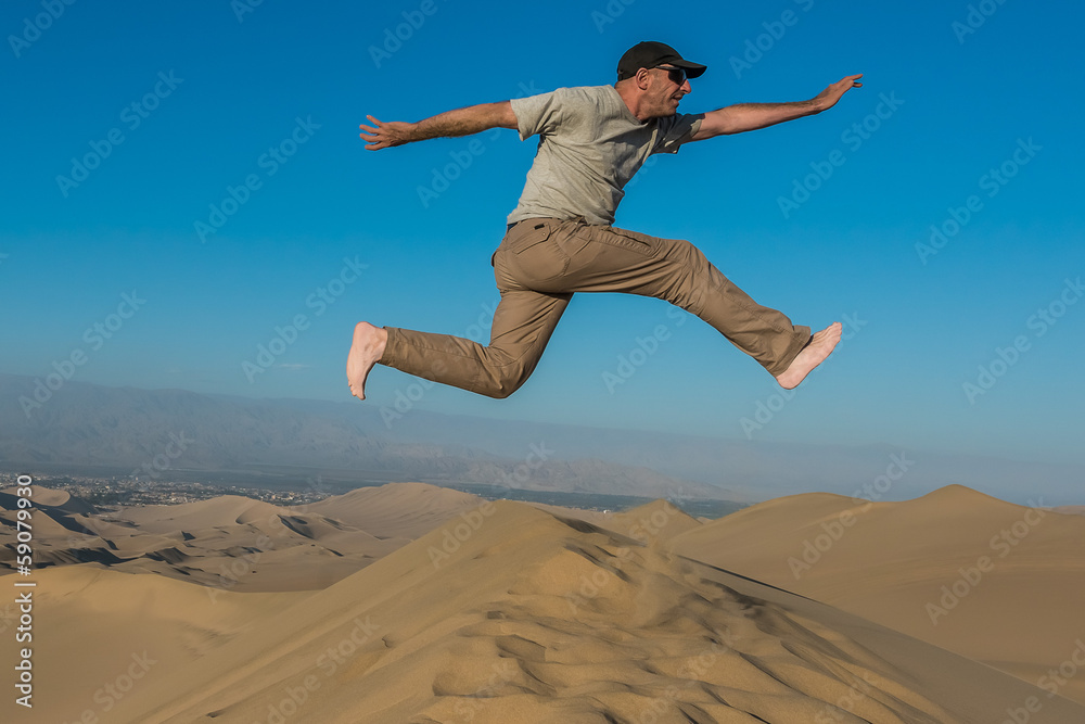 man jumping desert peruvian coast Ica Peru