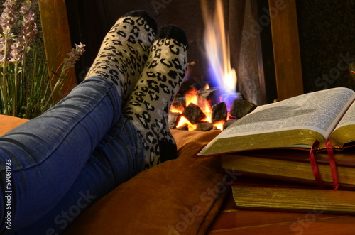 Warming feet by fire in the study