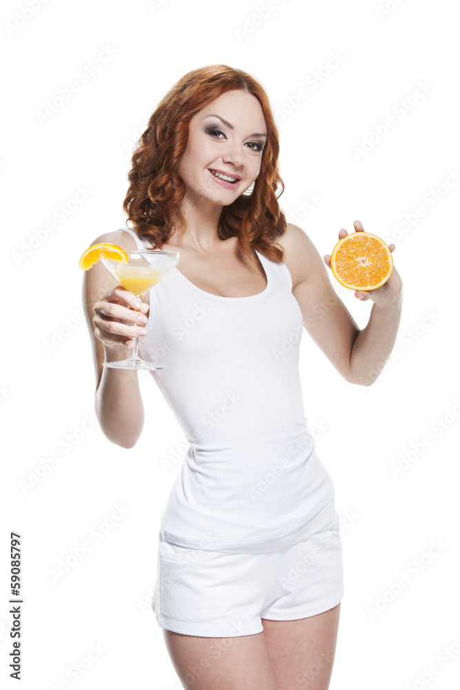 Beautiful girl in white outfit holding orange half and juice. Beautiful girl in white outfit holding orange half and juice.