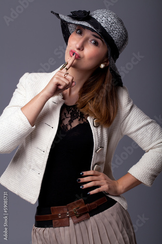 beautiful young woman in hat, swing shut