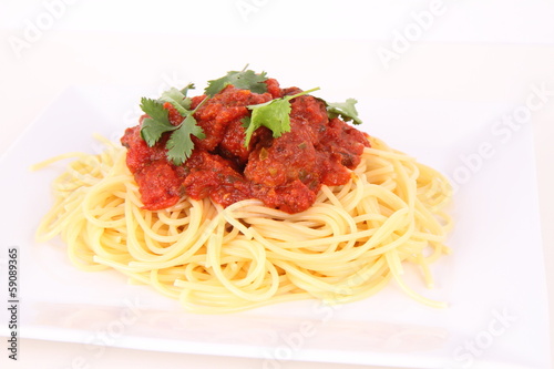 Pasta with meatballs decorated with coriander