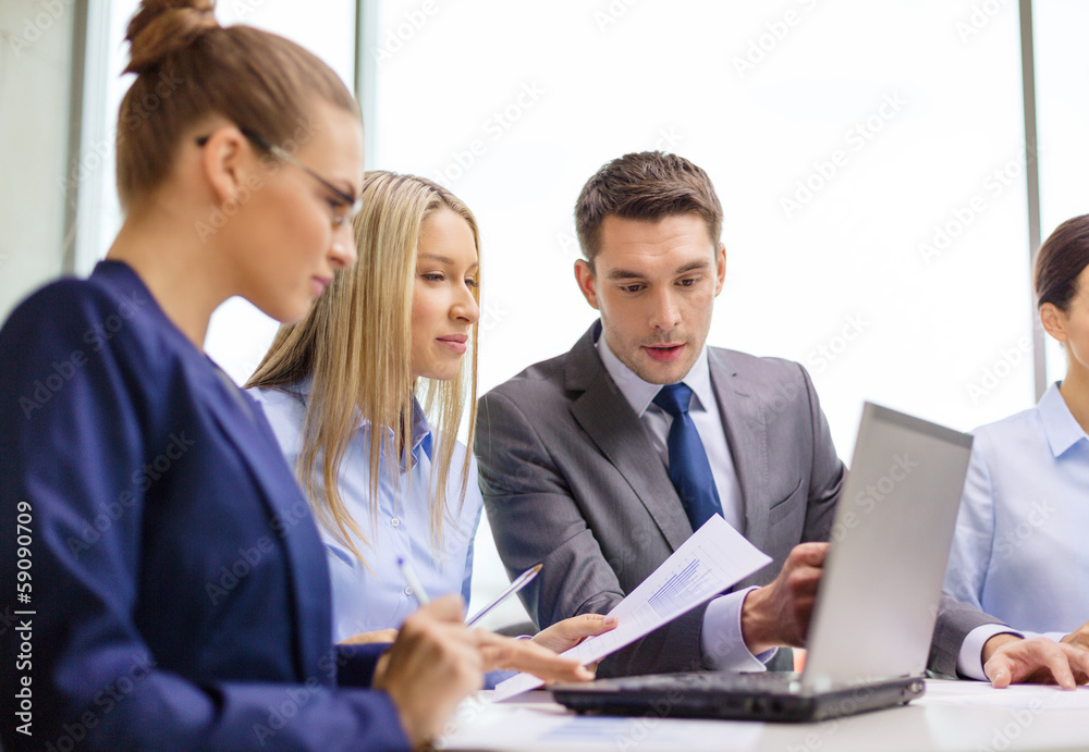 business team with laptop having discussion business team with laptop having discussion