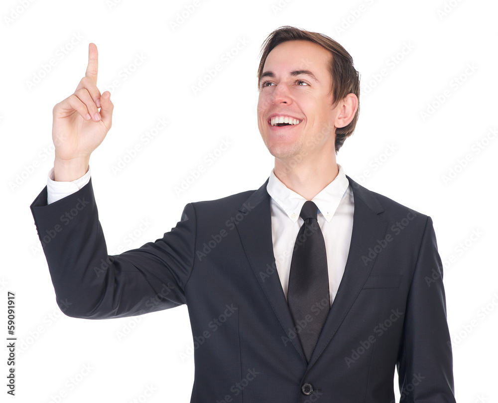 Confident young businessman smiling and pointing finger Confident young businessman smiling and pointing finger