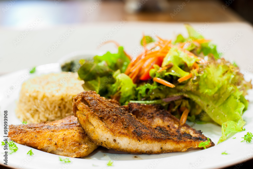 Fried Fish Steak with salad and fried rice