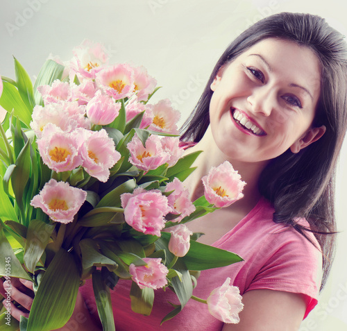 Beautiful happy woman with tulipes