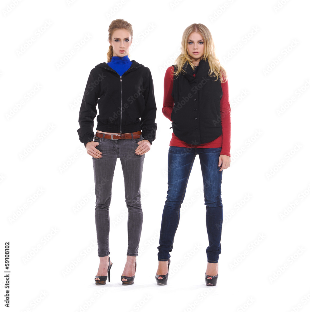 Fototapeta premium portrait Of two Attractive Young Women In Studio Standing