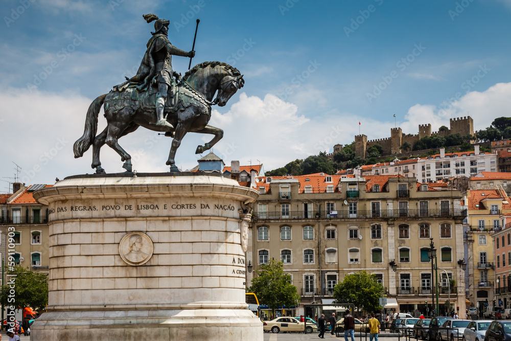 Statue of King Joao I at Figueiroa Square and St. Jorge Castle i