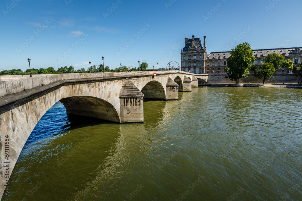 View of Louvre Palace and Pont Royal in Paris, France