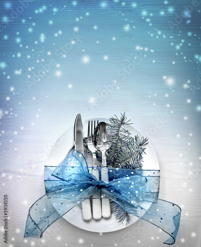 Christmas table place setting with christmas decorations