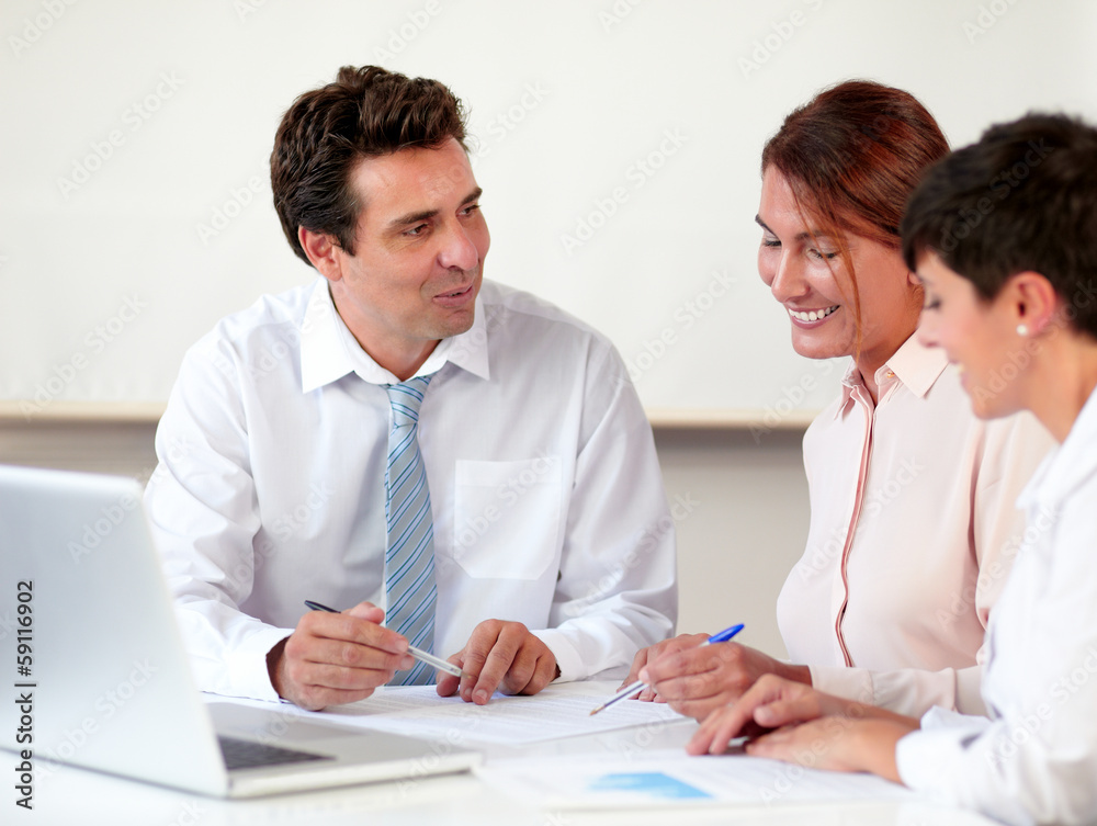 Charming professional group working on documents Charming professional group working on documents