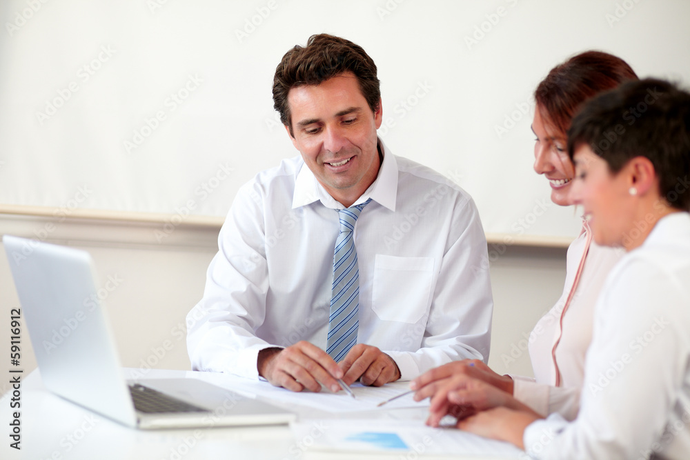 Professional hispanic group working on documents Professional hispanic group working on documents