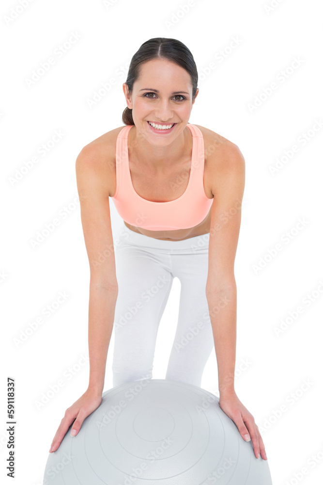 Portrait of a smiling fit woman with fitness ball Portrait of a smiling fit woman with fitness ball