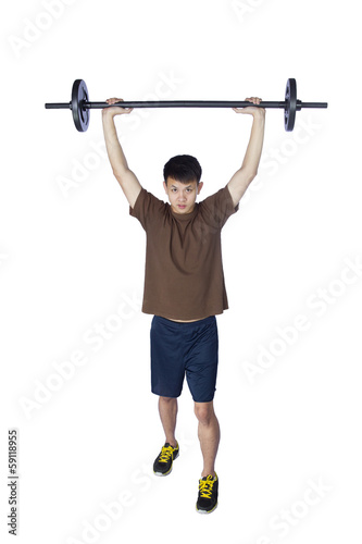 Young sports man with barbell