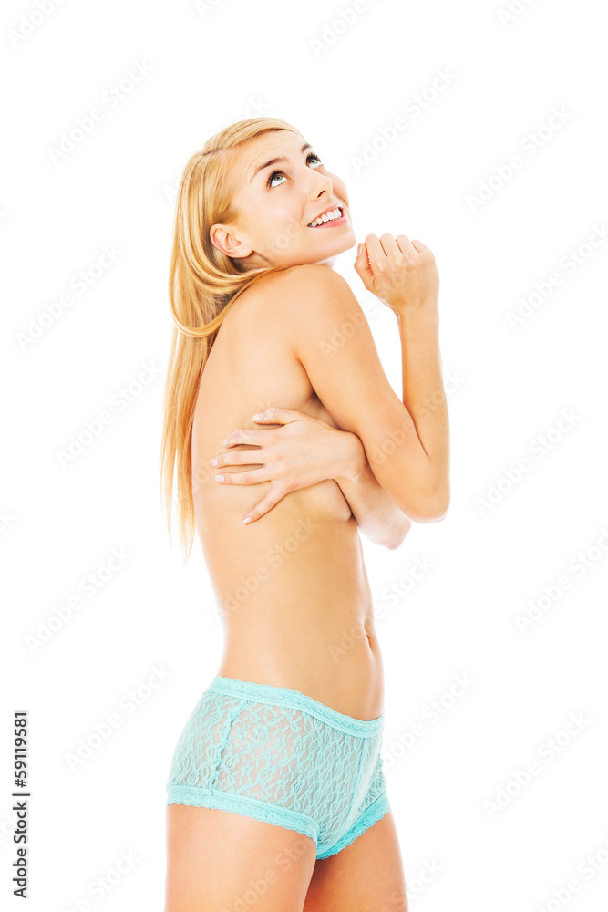 Fototapeta premium Woman In Blue Panty Covering Breasts While Looking Up
