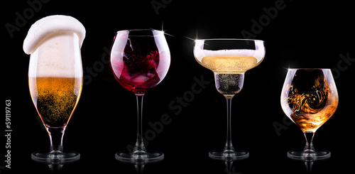 set with different drinks on black background