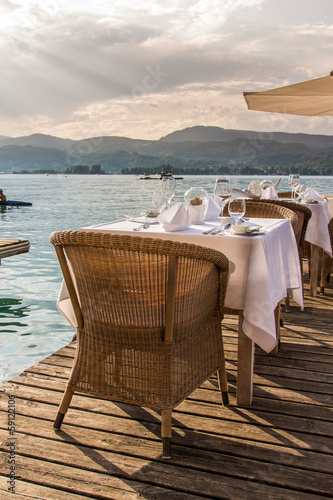 Luxurious restaurant with tables on pier