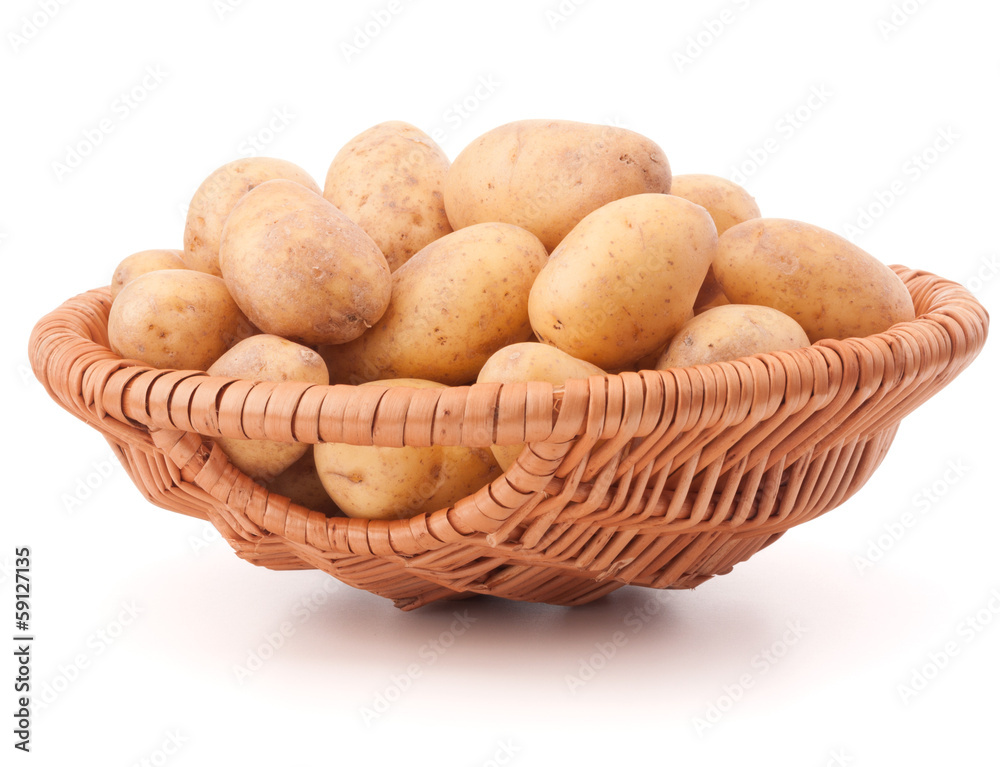 Potato tuber in wicker basket isolated on white background Potato tuber in wicker basket isolated on white background