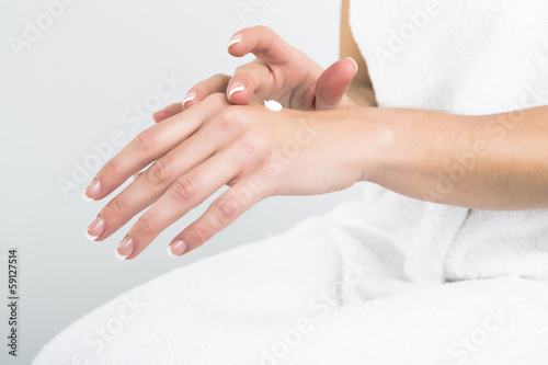 Applying hand lotion