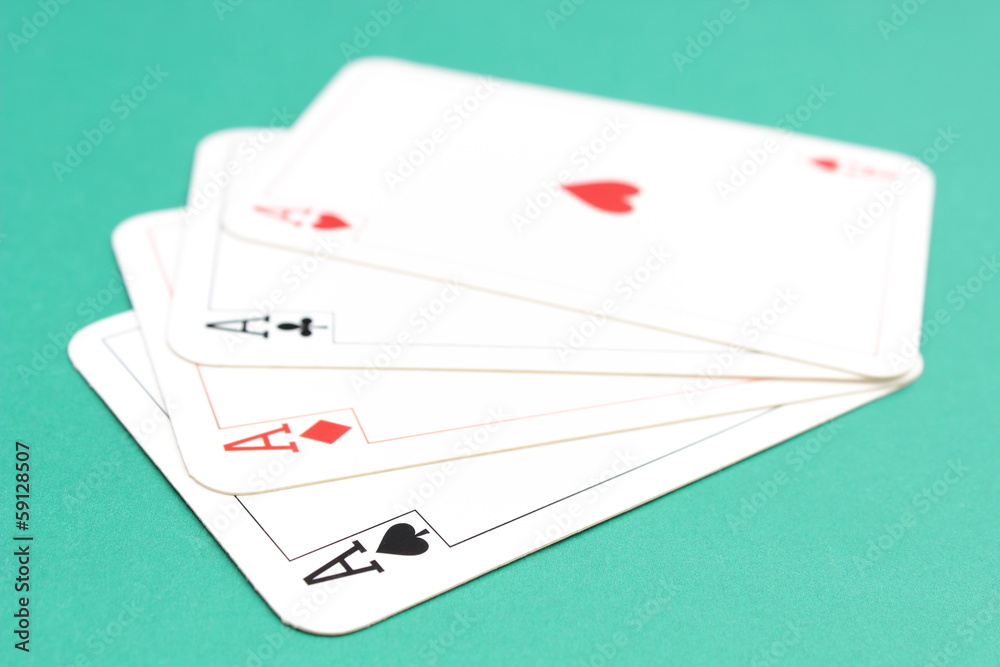 Composition of four aces on green background Composition of four aces on green background