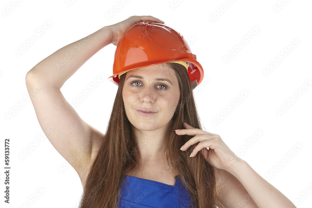 Handwerkerin mit Blaumann und Schutzhelm Handwerkerin mit Blaumann und Schutzhelm