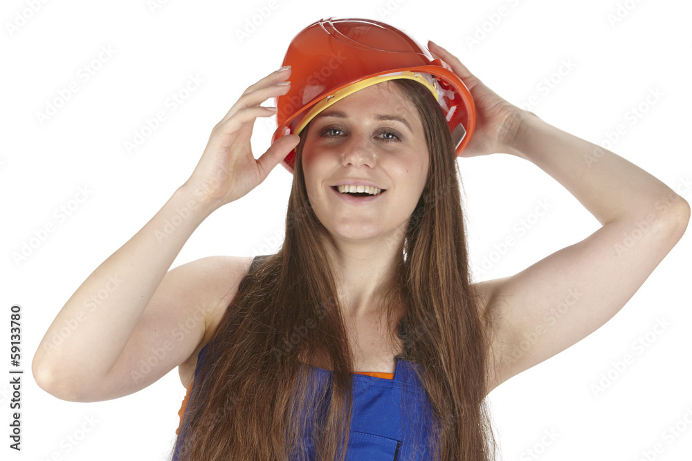 Handwerkerin mit Blaumann und Schutzhelm Handwerkerin mit Blaumann und Schutzhelm